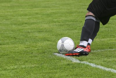 Kick a soccer ball